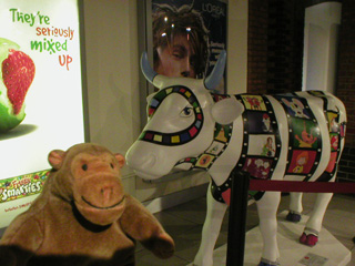 Mr Monkey with a cow covered in cartoon films