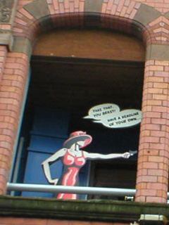 A cut-out lady in red shooting