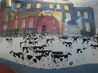 Detail of a cow-filled Lowry-like picture - click to turn the cow round