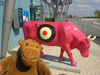 Mr Monkey with a pink cow marked with a large target