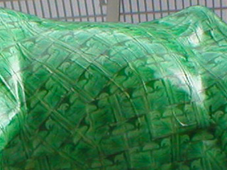 Detail of the green tiles covering the cow