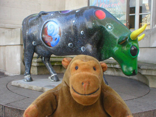 Mr Monkey with a cow decorated with space and planets