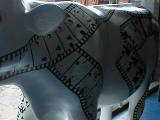 A cow decorated with a reel of film