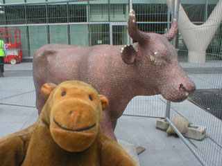 Mr Monkey with a cow covered in pennies