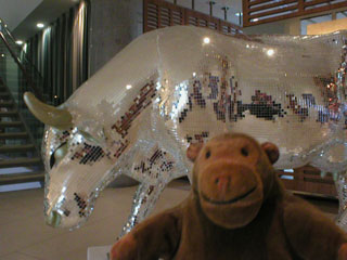 Mr Monkey with a cow disguised as a disco glitterball
