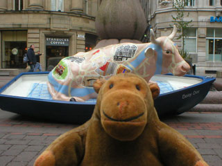 Mr Monkey with a cow in a boat