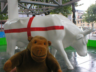 Mr Monkey and a white cow with a red cross on it