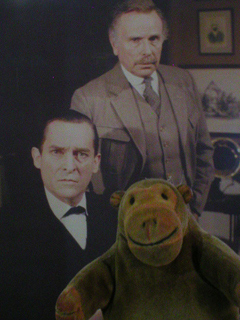 Mr Monkey in front of a giant still from Granada's Sherlock Holmes