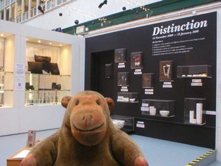Mr Monkey looking at the Distinction exhibition