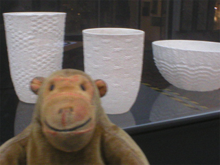 Mr Monkey looking at ceramics by Annette Bugansky