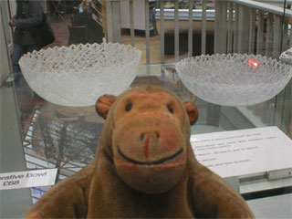 Mr Monkey looking at spun bowls by Jenny Bland
