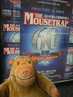 Mr Monkey looking at the Mousetrap poster outside the Opera House