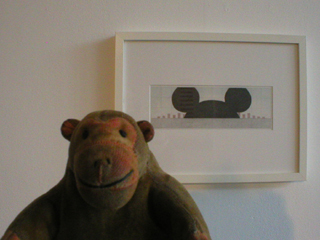 Mr Monkey looking at Mickey Mouse World by Kevin J Pocock