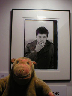 Mr Monkey looking at Ian Curtis Hulme, Manchester, 6 January 1979 by Kevin Cummins