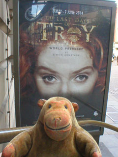 Mr Monkey looking at the The Last Days of Troy poster