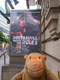 Mr Monkey looking at the Britannia Waves The Rules poster