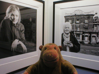 Mr Monkey looking at photographs of  (actor) and Shirley Baker (photographer)