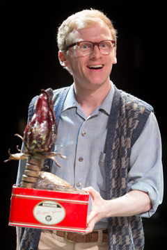 Seymour (Gunnar Cauthery) is pleased with a plant unknown to modern science (Royal Exchange Production photo)