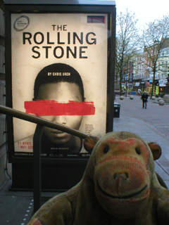 Mr Monkey looking at the The Rolling Stone poster