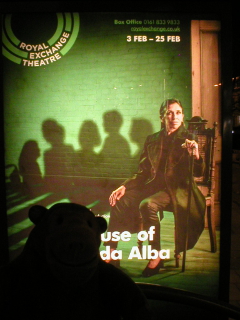 Mr Monkey looking at the poster for The House of Bernarda Alba