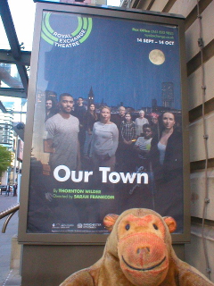 Mr Monkey looking at the poster for Our Town