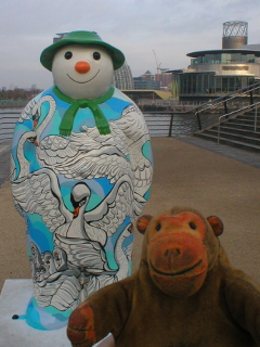 Mr Monkey looking at the Seven Swans a-Swimming snowman