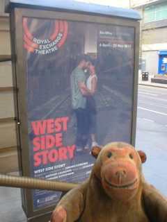 Mr Monkey looking at the poster for West Side Story