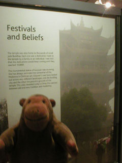 Mr Monkey reading the Festivals and Beliefs panel