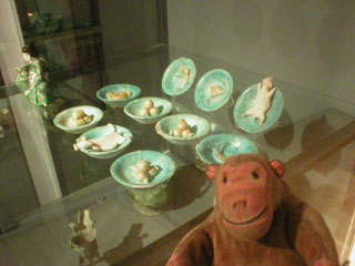 Mr Monkey examining Ming dynasty bowls of food for the afterlife
