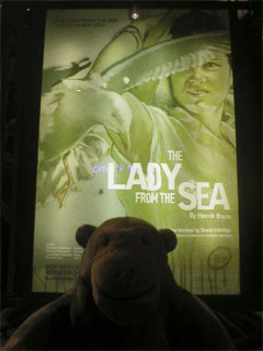 Mr Monkey looking at the poster for The Lady From The Sea