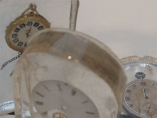 Detail of mixed media clock sculptures by Nadia Peters