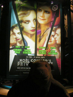 Mr Monkey looking at the poster for Private Lives