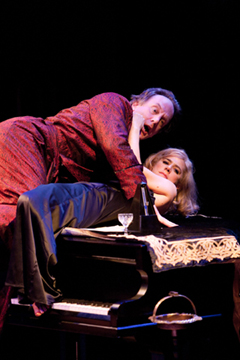 Elyot (Simon Robson), Amanda (Imogen Stubbs), a piano and a compromising position (Royal Exchange Theatre production photo)