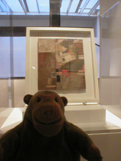 Mr Monkey looking at a Merz collage by Kurt Schwitters