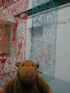 Mr Monkey looking at Work and Fish by Claire Knox-Bentham