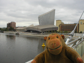 Mr Monkey looking at IWM North from the new footbridge