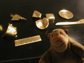 Mr Monkey examining some donations after gilding