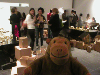 Mr Monkey watching people buying golden items