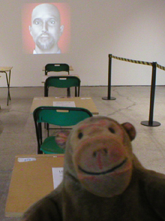 Mr Monkey looking at Life in the UK : Ian and the exam space