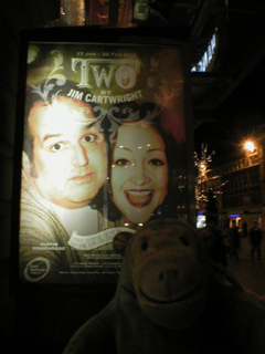 Mr Monkey looking at the Two poster outside the theatre