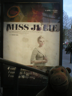 Mr Monkey looking at the Miss Julie poster outside the theatre