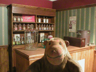 Mr Monkey looking at a recreation of a temperance bar