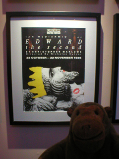 Mr Monkey looking at the poster for the 1986 production of Edward II