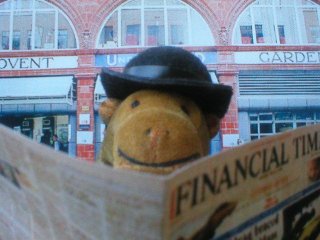 Mr Monkey reading the Financial Times outside Covent Garden underground station