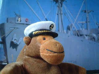 Captain Monkey in front of a Liberty ship