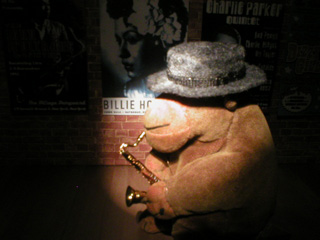 Mr Monkey in the spotlight, playing his saxophone