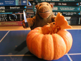 Mr Monkey plugging the top plug out of the pumpkin