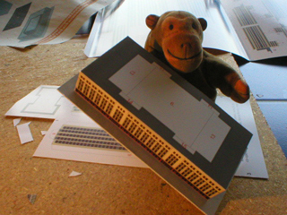 Mr Monkey with the newly constructed base of the building