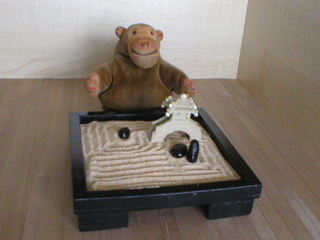 Mr Monkey contemplating the Zen garden