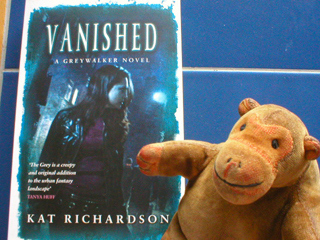 Mr Monkey beside Vanished by Kat Richardson